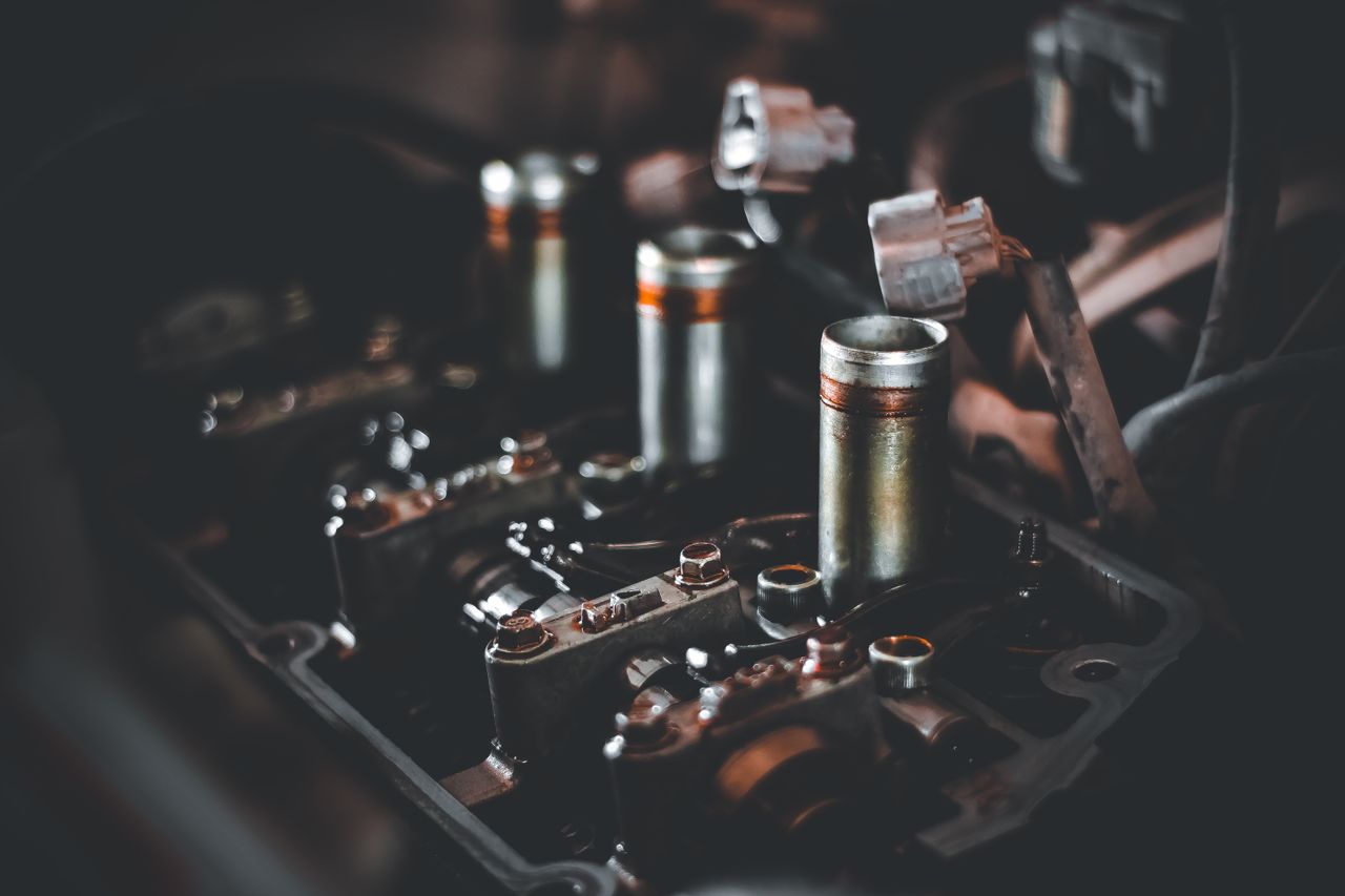 Services Detailed view of engine parts showcasing camshaft and cylinder head mechanics.